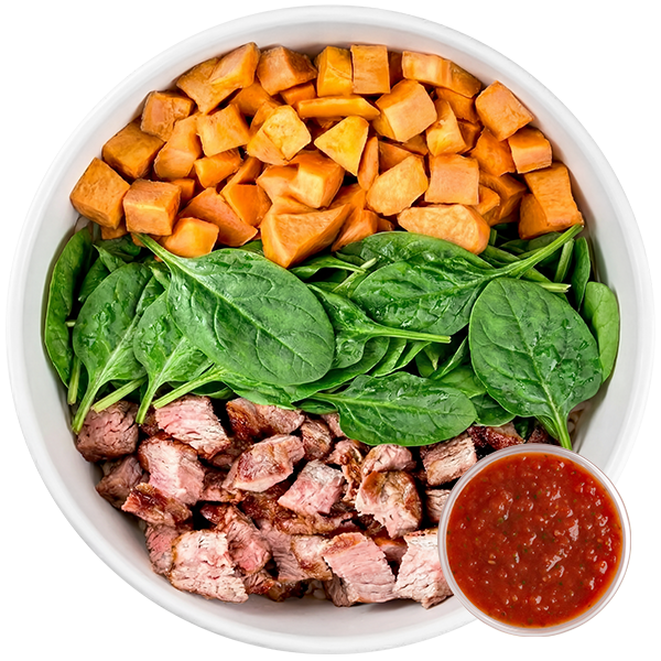 Meal prep bowl with sweet potato rounds, spinach, grass-fed bison and PH Salsa.