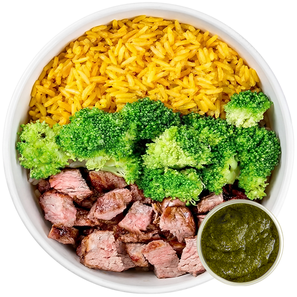 Meal prep bowl with turmeric rice, broccoli, grass-fed beef and chimichurri sauce.